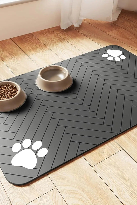 Soft absorbent pet feeding mat under dog food and water bowls